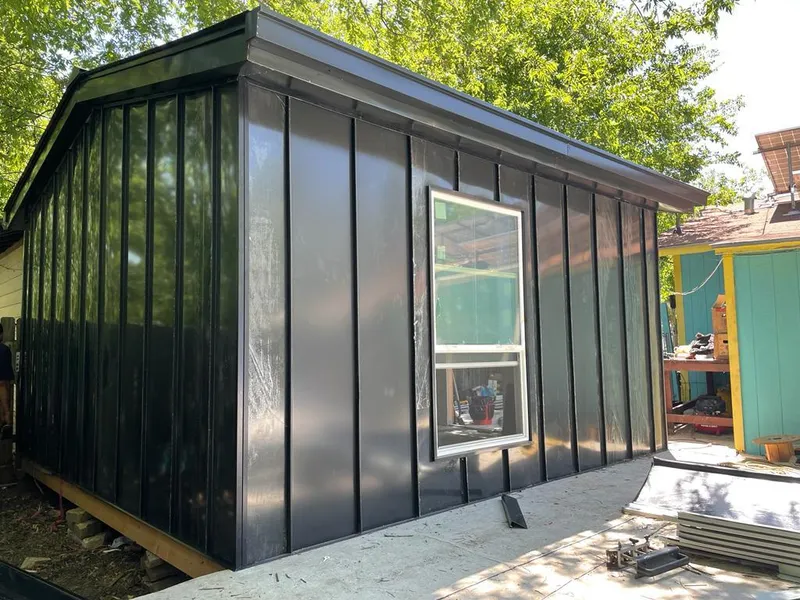 Black standing seam metal wall panels for Roof Inspection in Stanton